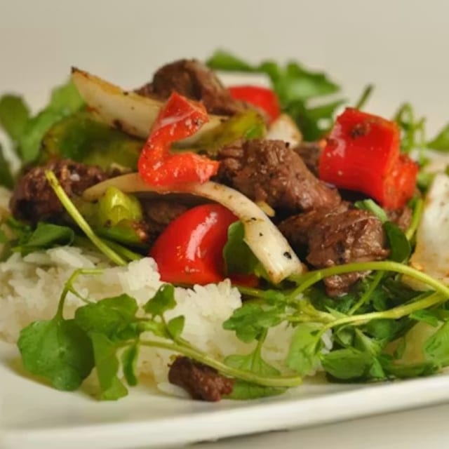 Tank's Chef Shaken Beef Served With Eggs Noodles.